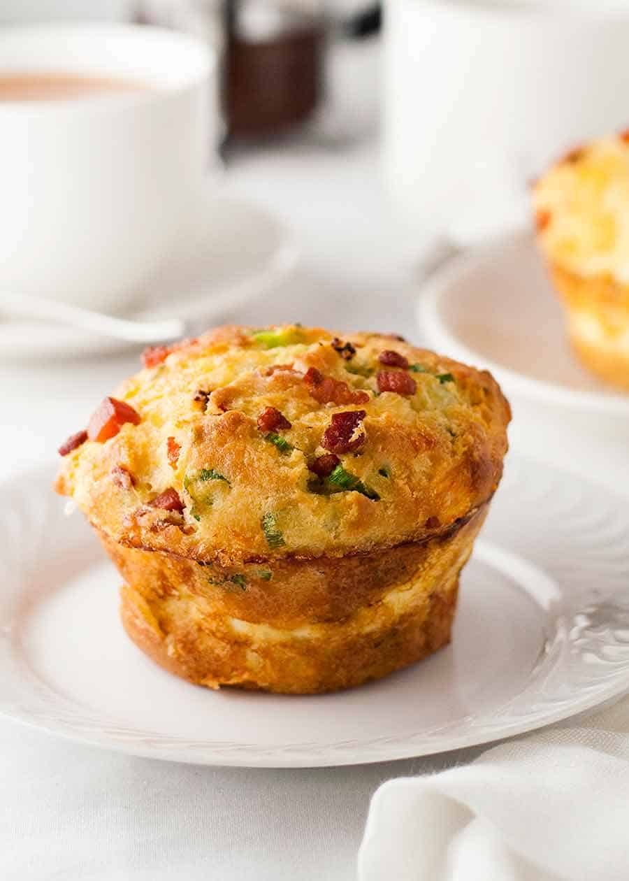 Bacon and Egg Breakfast Muffin on white plate, ready to be eaten