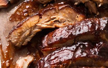 Close up of Barbecue Pork Ribs cooked in Oven with sticky barbecue sauce