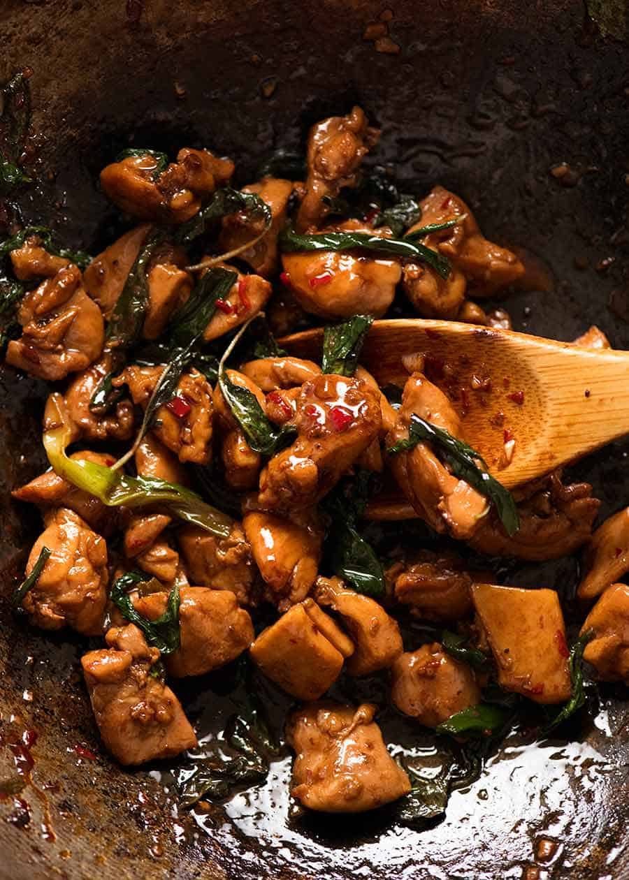 Close up of Thai Basil Chicken in a wok, fresh off the stove ready to be served