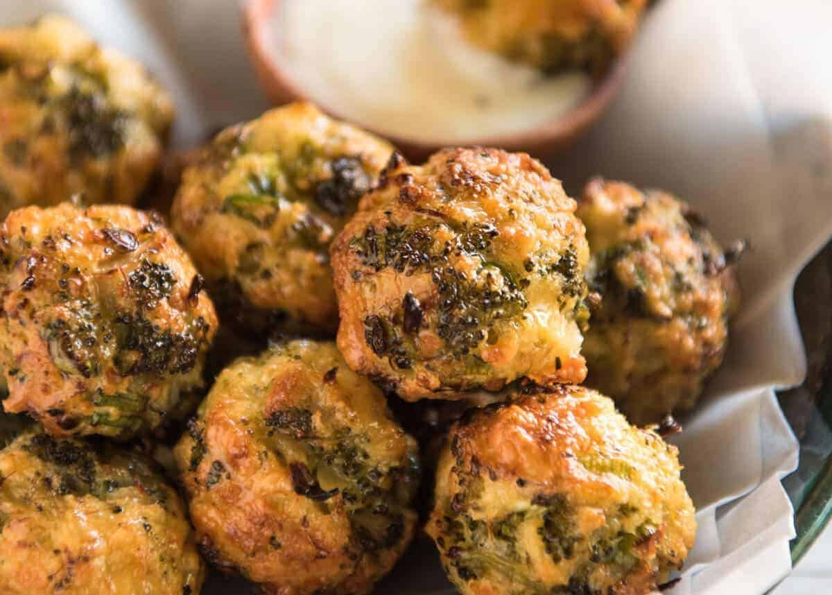 Baked Broccoli Cheese Balls - outrageously delicious as a meal or bites to serve at a gathering! Served with a Yoghurt Lemon Sauce. recipetineats.com