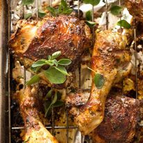 Baked Greek Chicken on a tray, fresh out of the oven
