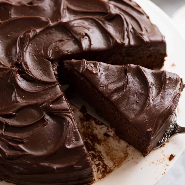 Easy Chocolate Fudge Cake being cut