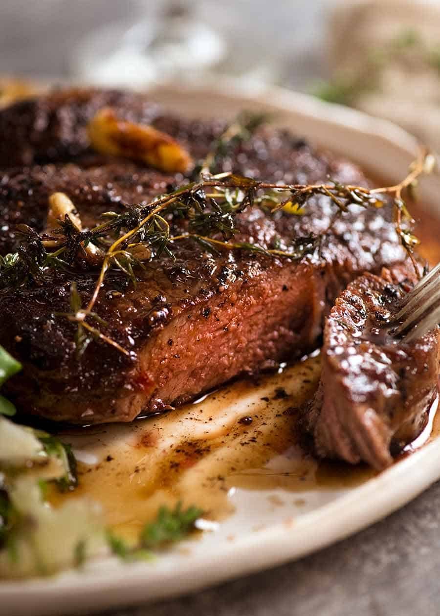 Close up showing the inside of sliced pan seared steak