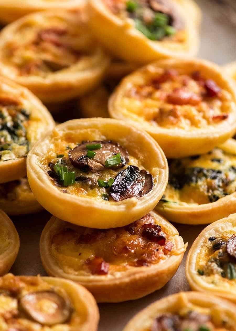 Platter filled with canape finger food quiche 