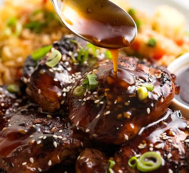 Pour honey soy sauce over chicken